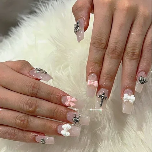 Bow and Charm nail art — nude coffin nails with 3D bows and rhinestones